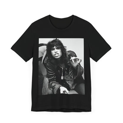 A black graphic t-shirt featuring a retro 70s photo of Aerosmith band members lounging in leather, exuding a cool, classic rock vibe.