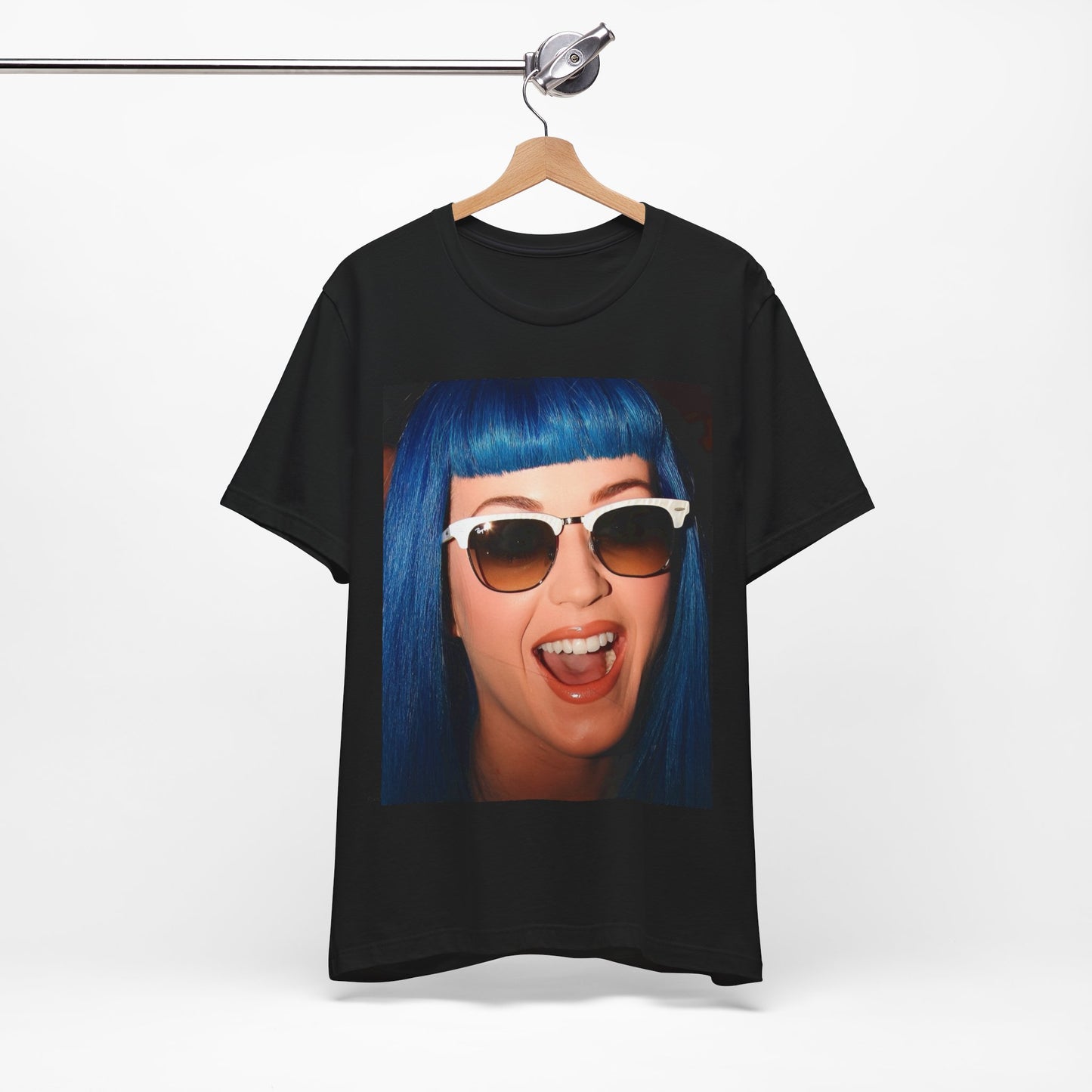 A black graphic t-shirt featuring a retro graphic of Katy Perry with blue hair.