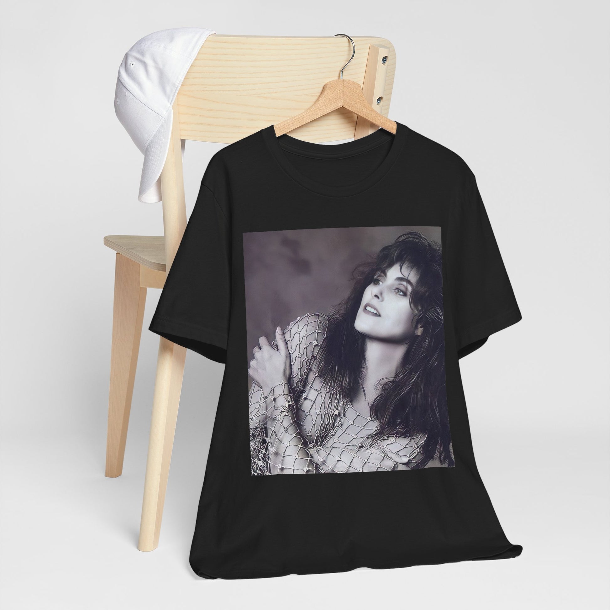 A black graphic t-shirt featuring a bold 80s superstar graphic of Laura Branigan.