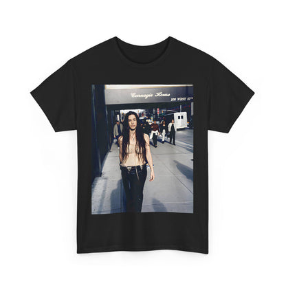 A black graphic t-shirt featuring a 90s-style graphic of Alanis Morissette with New York City elements or skyline in the background.