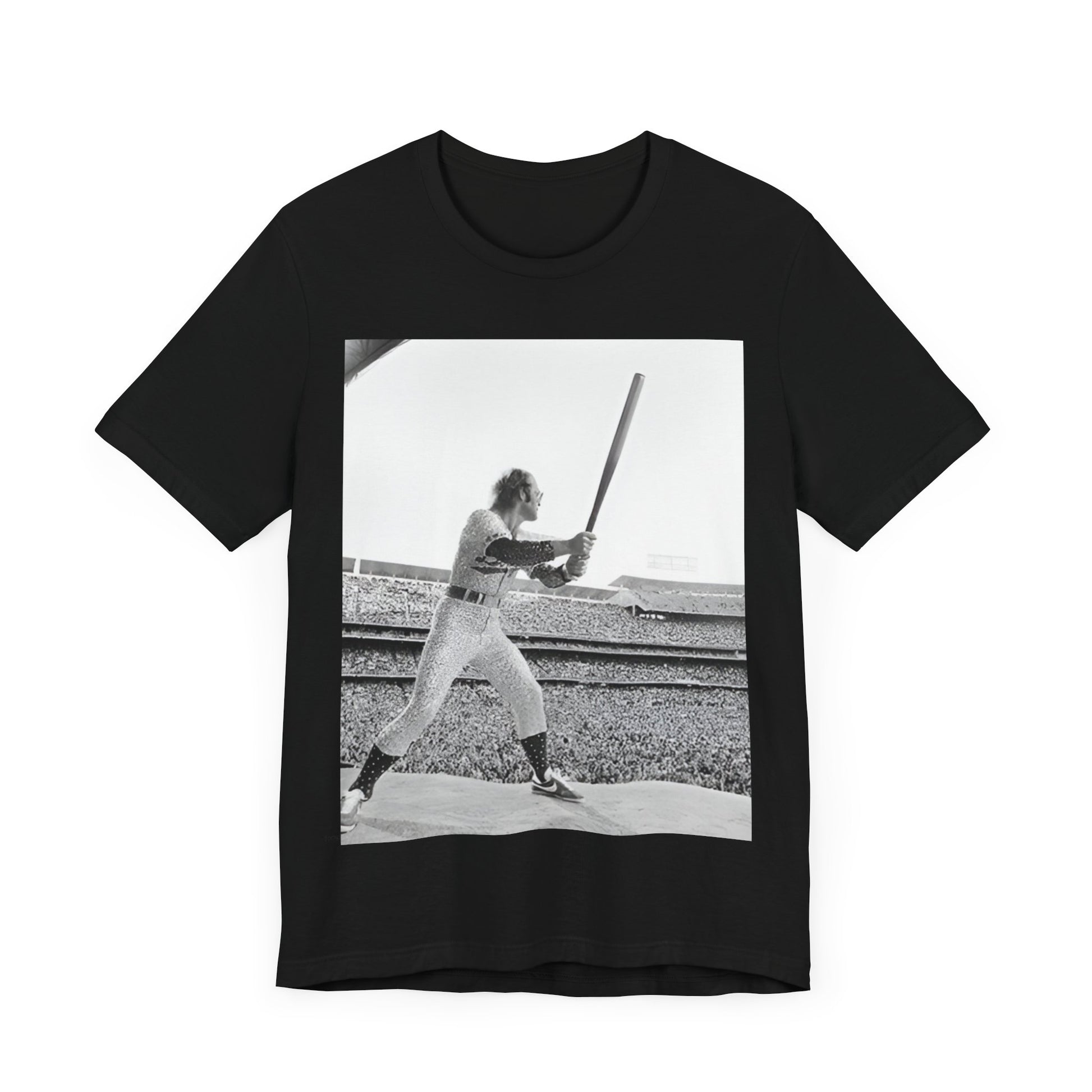 A black graphic t-shirt featuring a black and white graphic or photo related to Elton John's 1975 tour in America.