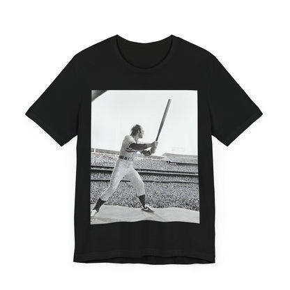 A black graphic t-shirt featuring a black and white graphic or photo related to Elton John's 1975 tour in America.