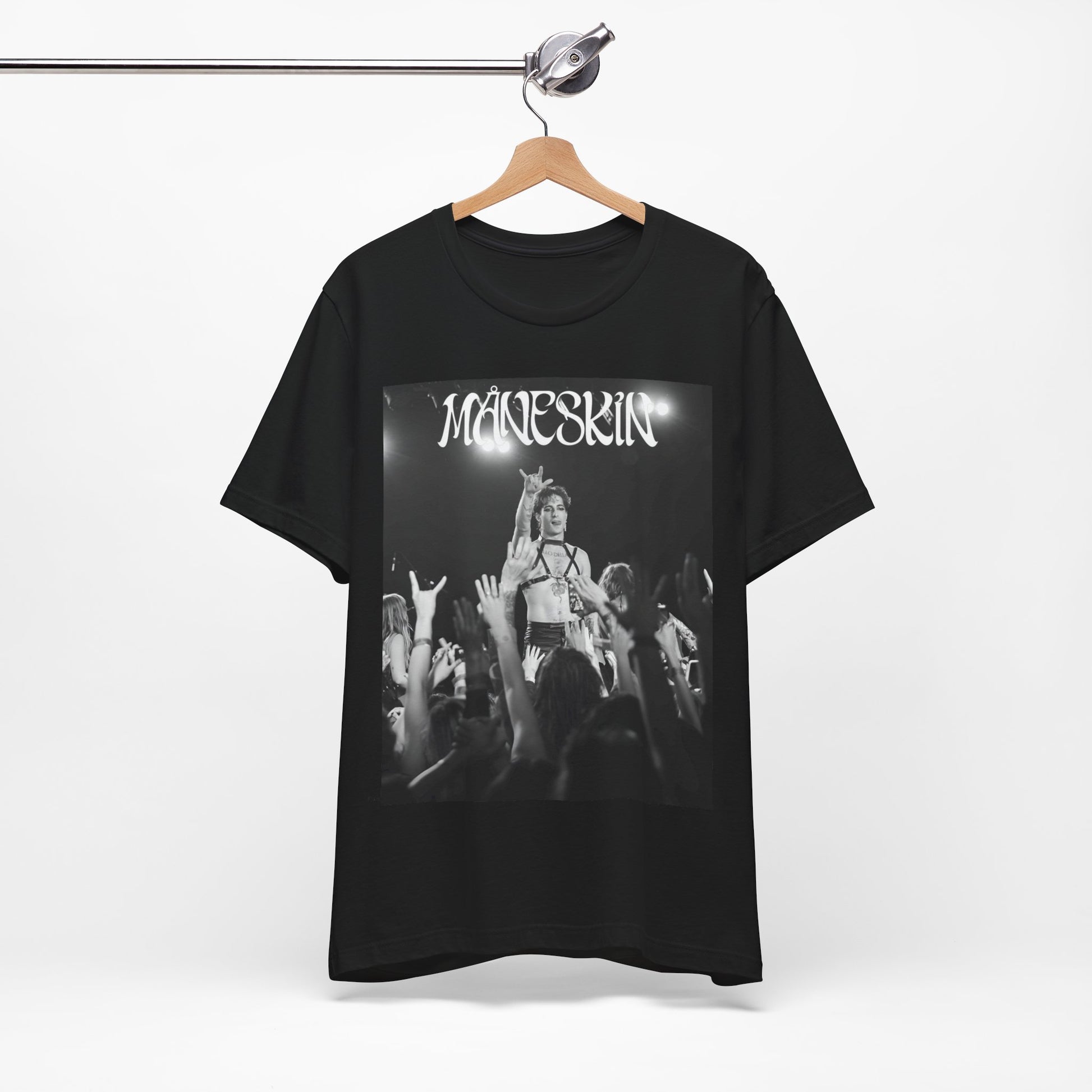 A black graphic t-shirt featuring a graphic or photo of Maneskin performing live.