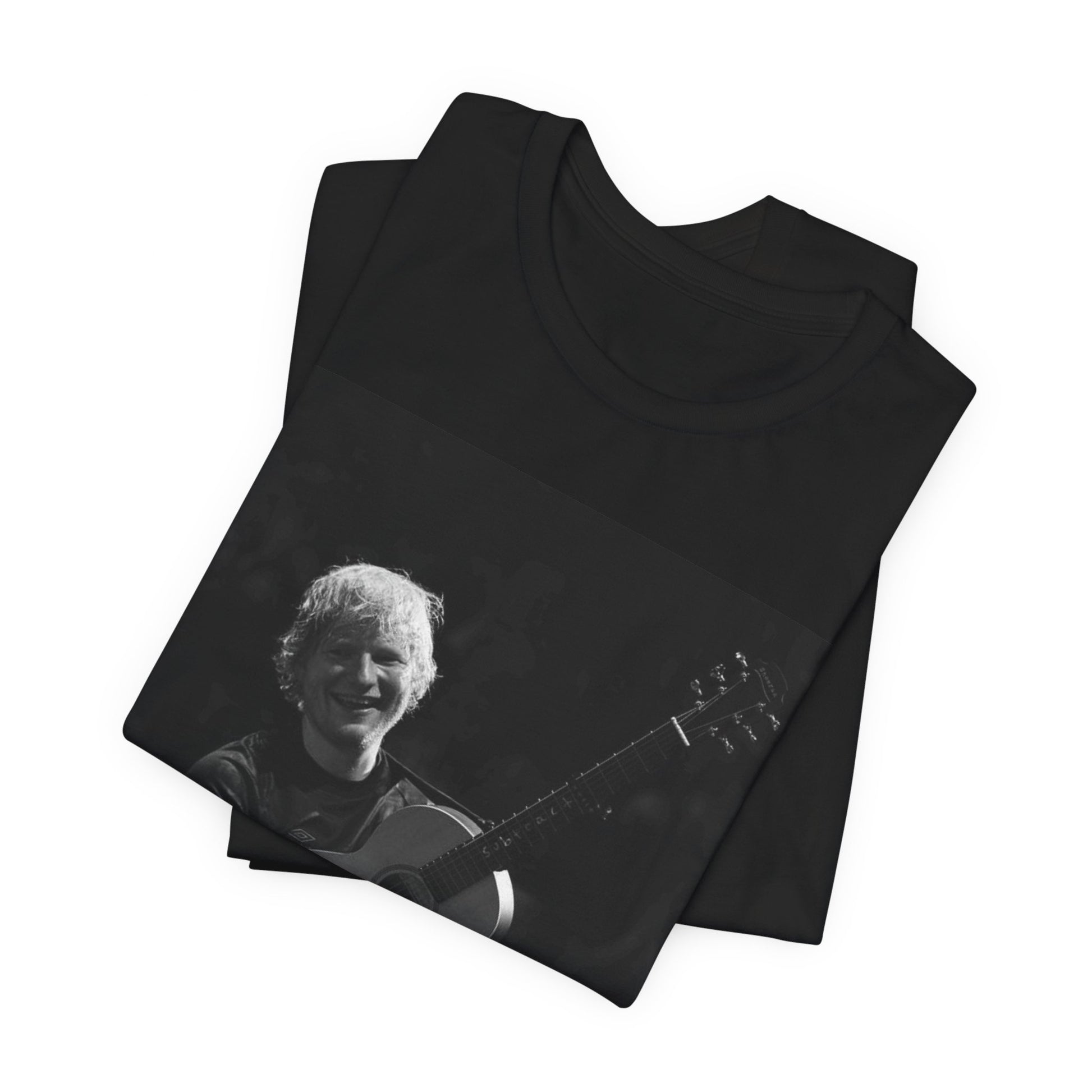 A black graphic t-shirt featuring a photo of Ed Sheeran performing live with his guitar.