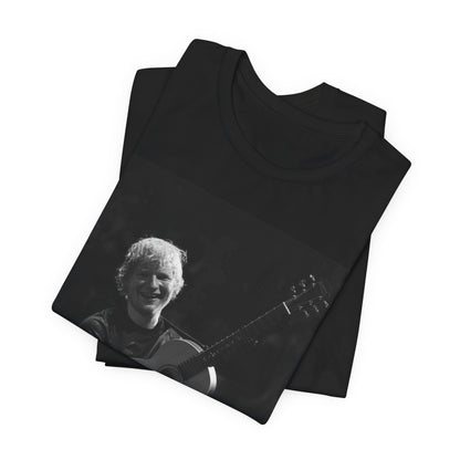 A black graphic t-shirt featuring a photo of Ed Sheeran performing live with his guitar.