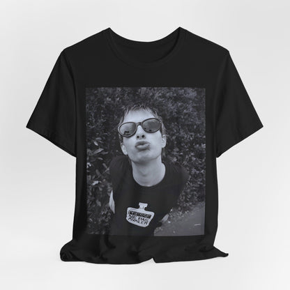 A black graphic t-shirt featuring a retro 90s graphic of Thom Yorke from Radiohead.