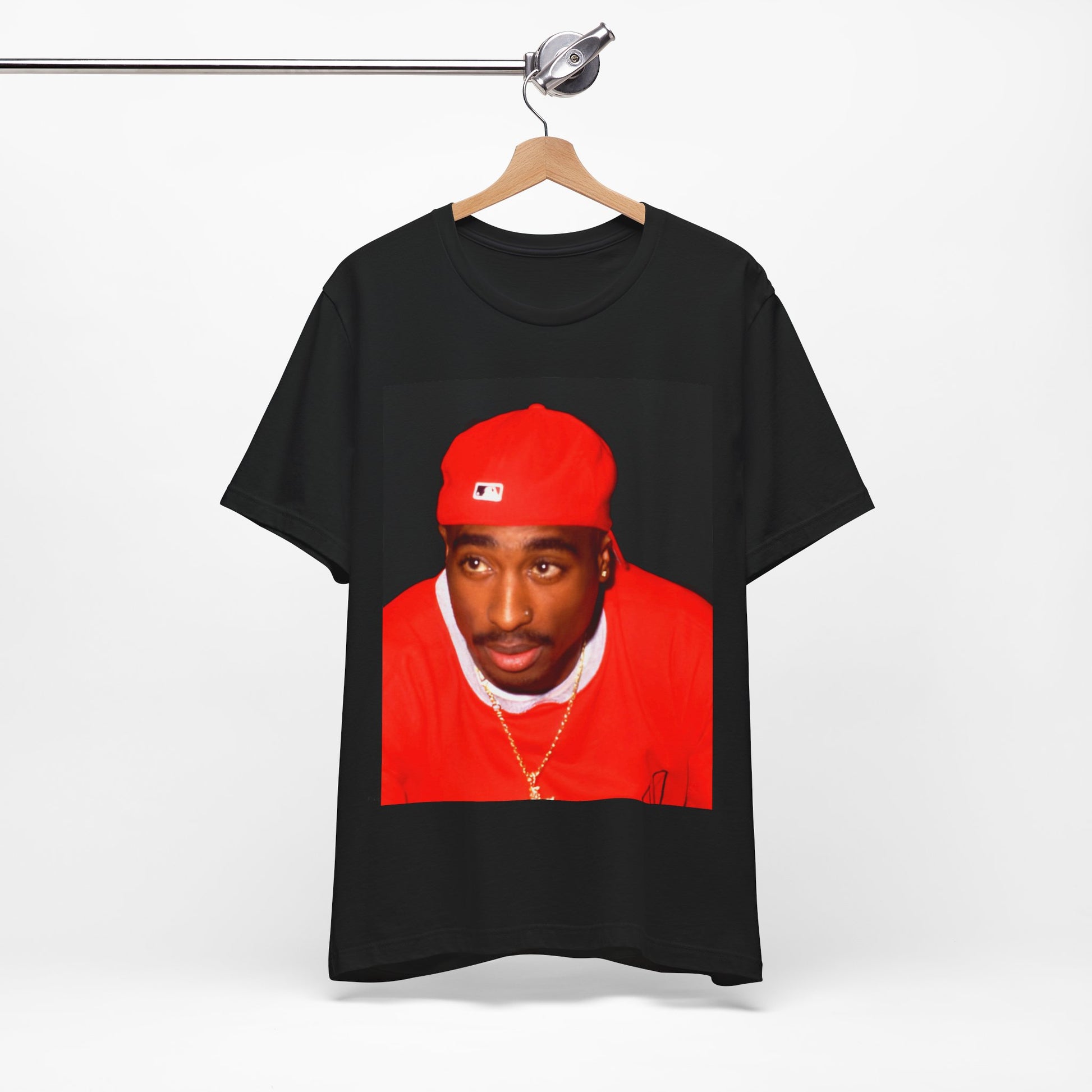 A black graphic t-shirt featuring a fierce graphic related to Tupac's 'California Love' song or era.