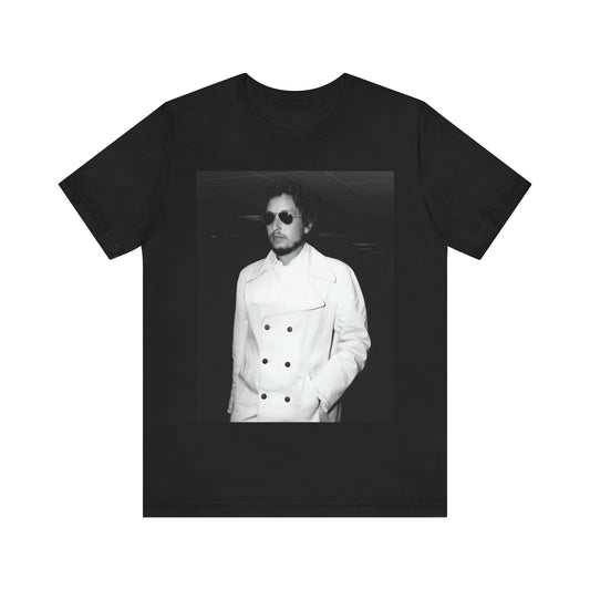 A black graphic t-shirt featuring a vintage black and white photo of Bob Dylan in a contemplative or iconic pose.