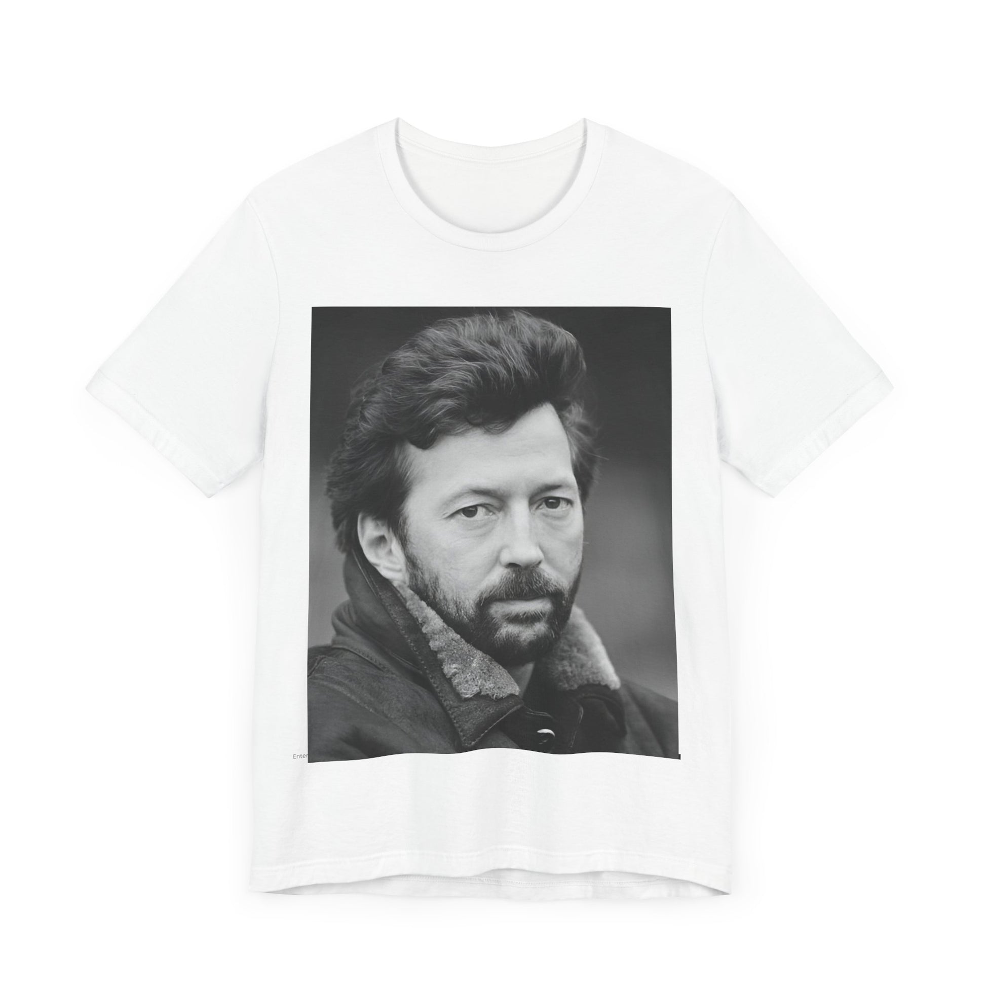 A black graphic t-shirt featuring a 70s rock aesthetic graphic of Eric Clapton.