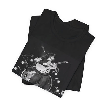 A black graphic t-shirt featuring a vintage photo of Foo Fighters performing live.