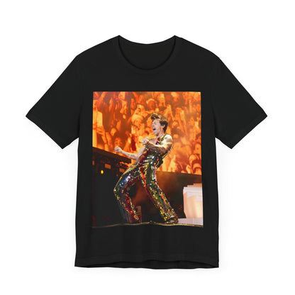 A black graphic t-shirt featuring a graphic related to Harry Styles' 'As It Was' song or era, possibly a live performance.