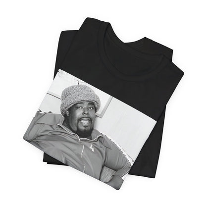 A black graphic t-shirt featuring a 70s-style portrait photo of Barry White in a lounge setting.