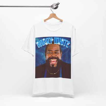 A black graphic t-shirt featuring a vintage 70s-style graphic of Barry White, emphasizing his smooth, iconic look.