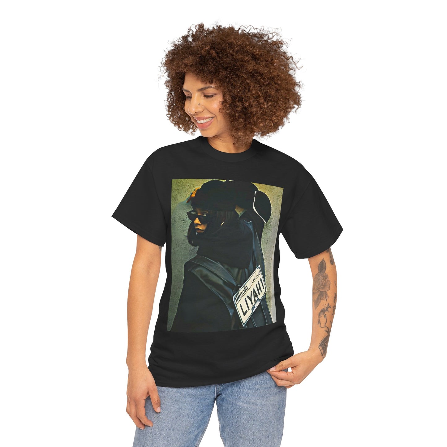 A black graphic t-shirt featuring a graphic of Aaliyah as the queen of urban rap legacy.