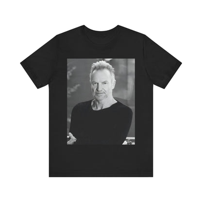 A black graphic t-shirt featuring a vintage graphic related to Sting's 'Desert Rose' song or era.