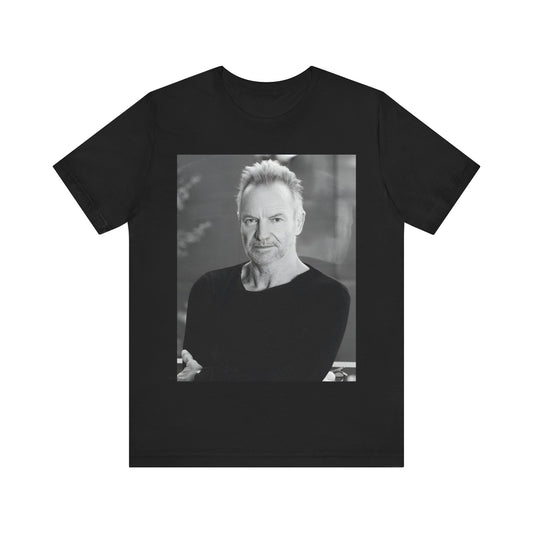 A black graphic t-shirt featuring a vintage graphic related to Sting's 'Desert Rose' song or era.