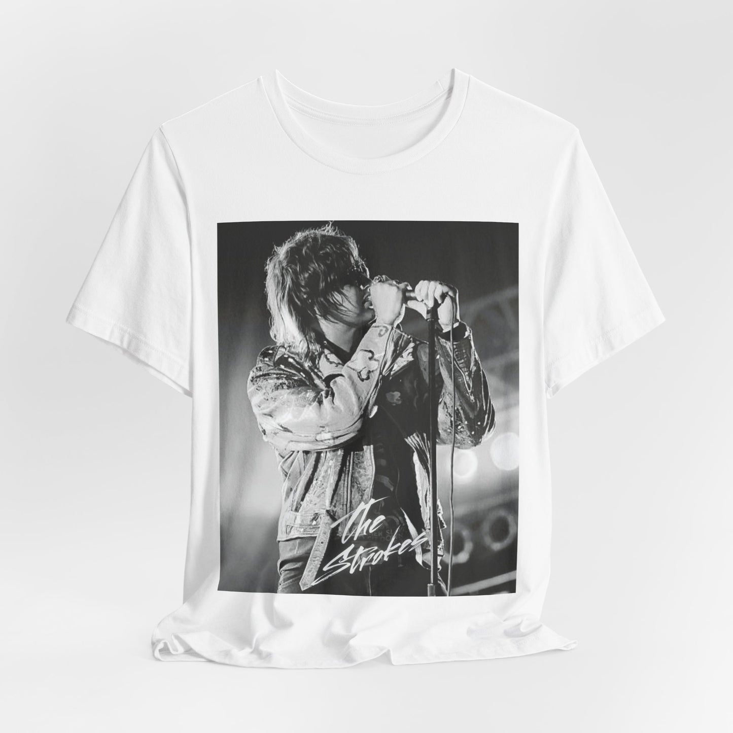 A black graphic t-shirt featuring a vintage graphic related to The Strokes' 'Last Nite' song or era.