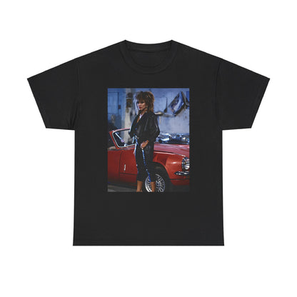 A black graphic t-shirt featuring an 80s graphic of Tina Turner as a powerful rock woman.