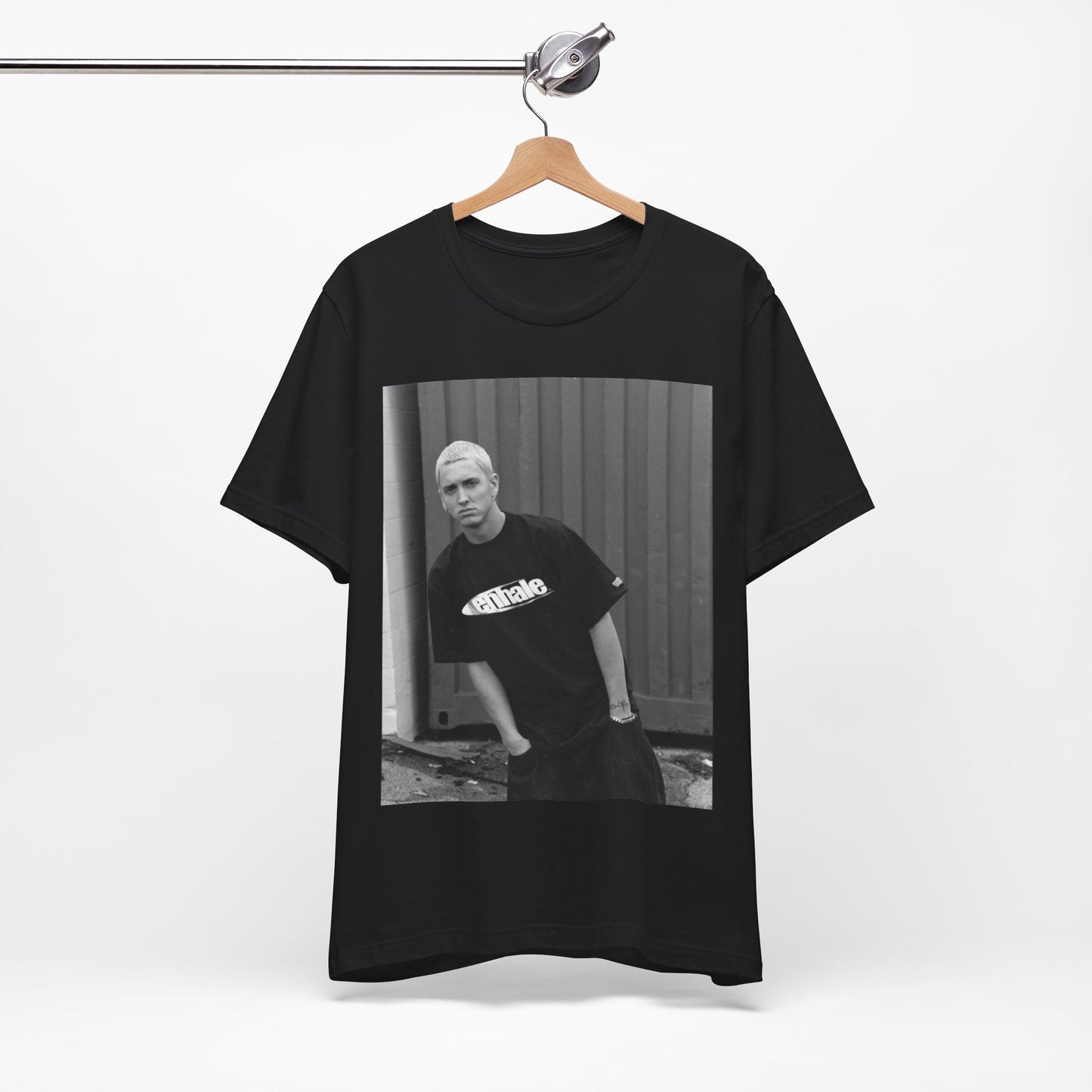 A black graphic t-shirt featuring a graphic of Eminem with a Detroit hip hop aesthetic.