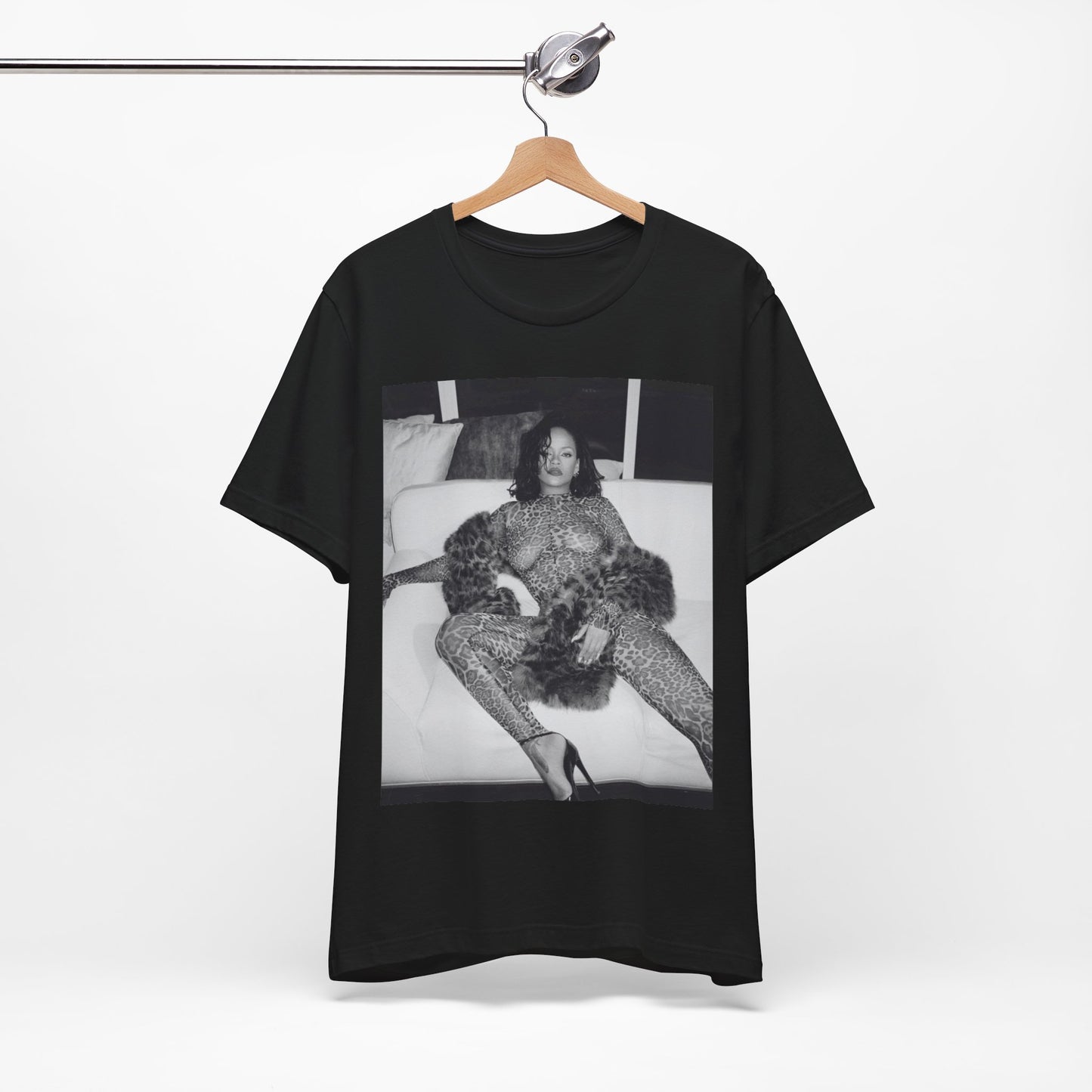 A black graphic t-shirt featuring a black and white, monochrome graphic or photo of Rihanna in a sexy pose.