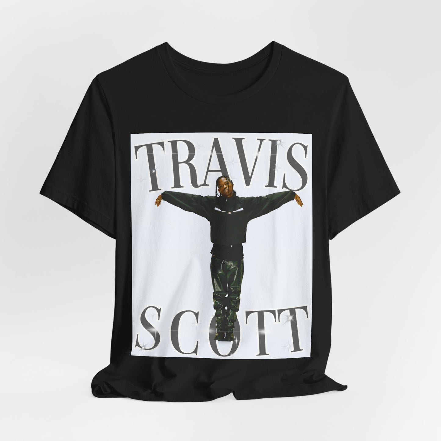 A black graphic t-shirt featuring a cool streetwear icon graphic of Travis Scott.