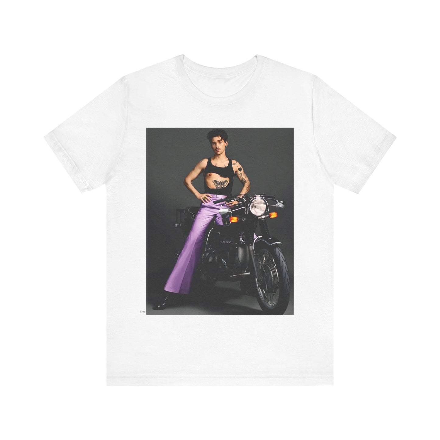 A black graphic t-shirt featuring a graphic of Harry Styles related to motorcycles or a rebellious, cool style.