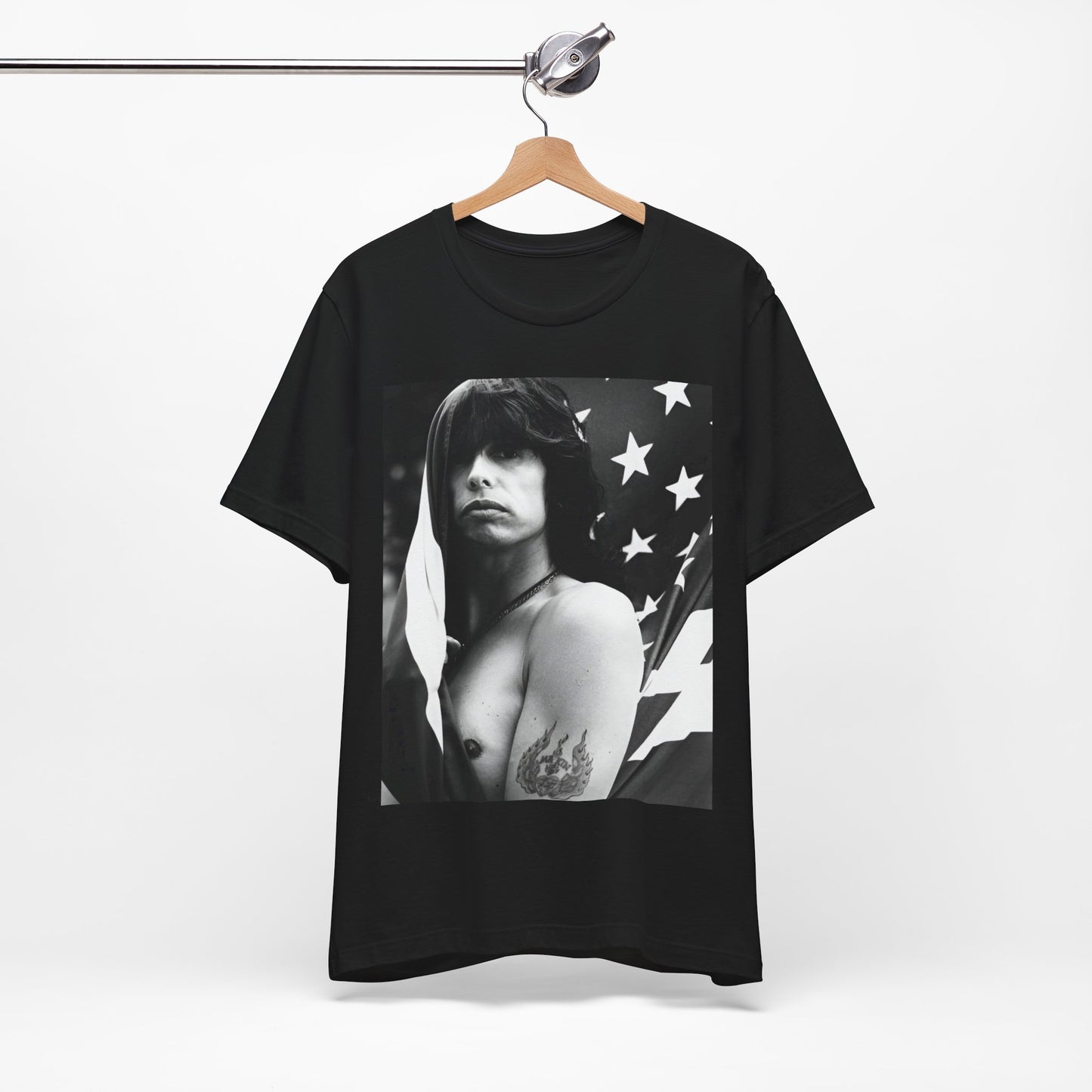 A black graphic t-shirt featuring a retro 70s-style illustration or photo of Aerosmith, integrated with elements of the American flag.