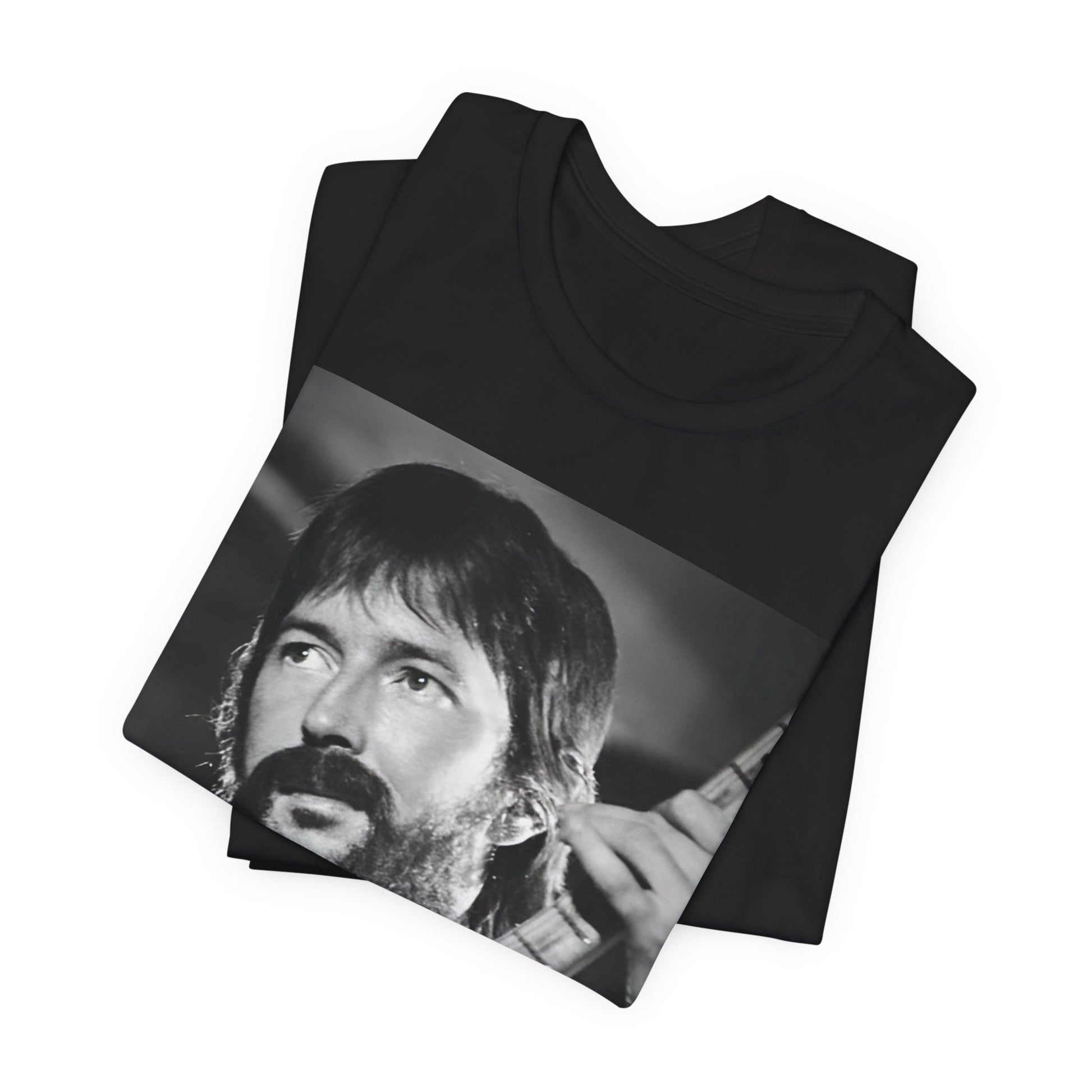 A black graphic t-shirt featuring a graphic of Eric Clapton as an authentic guitar god.