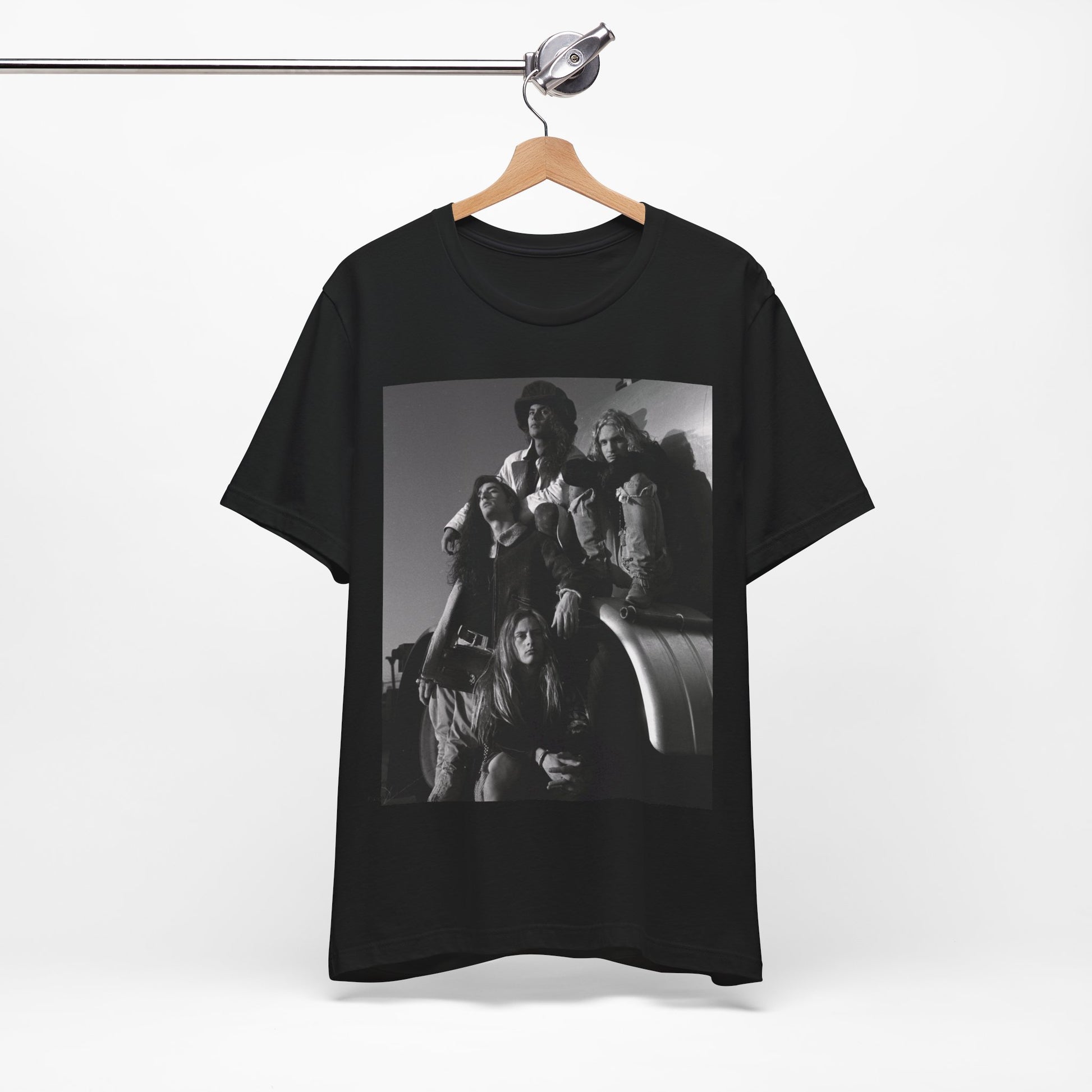 A black graphic t-shirt featuring a 90s black and white photographic portrait of the band Alice In Chains, capturing their iconic grunge look.
