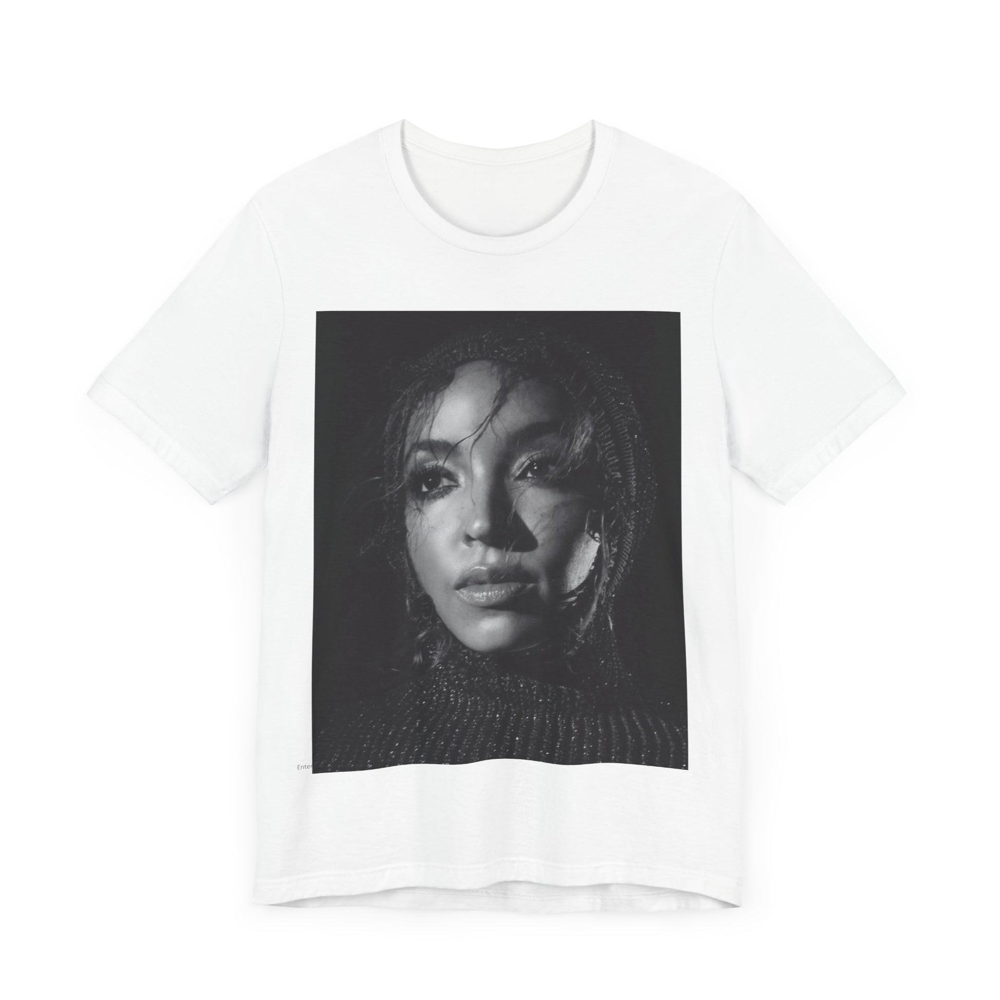 A black graphic t-shirt featuring a black and white portrait photo of Tinashe.