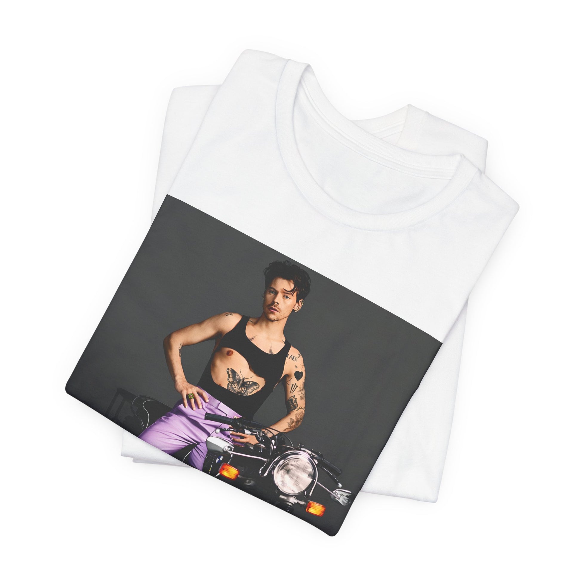 A black graphic t-shirt featuring a graphic of Harry Styles related to motorcycles or a rebellious, cool style.
