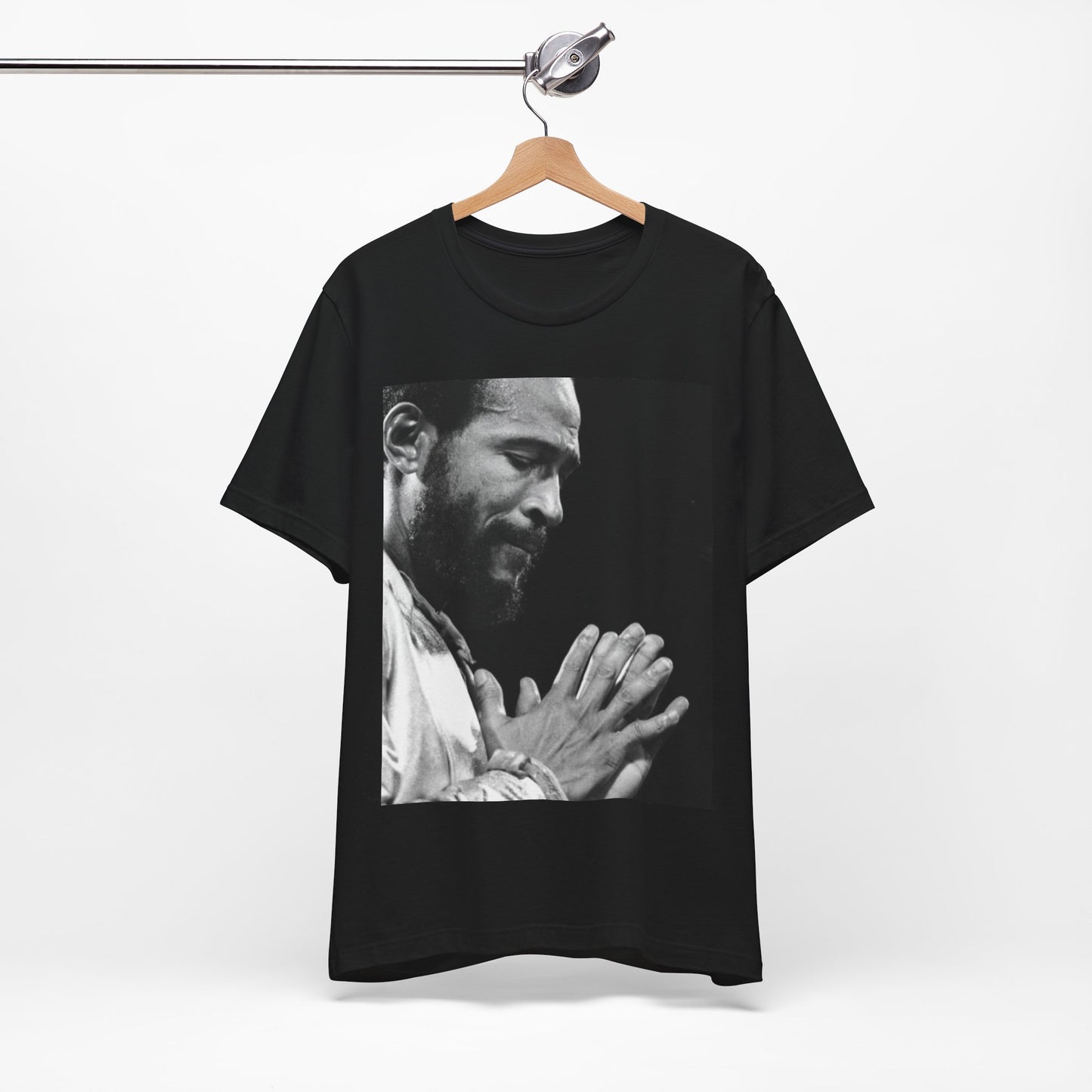 A black graphic t-shirt featuring a 70s graphic of Marvin Gaye emphasizing his soulful voice.