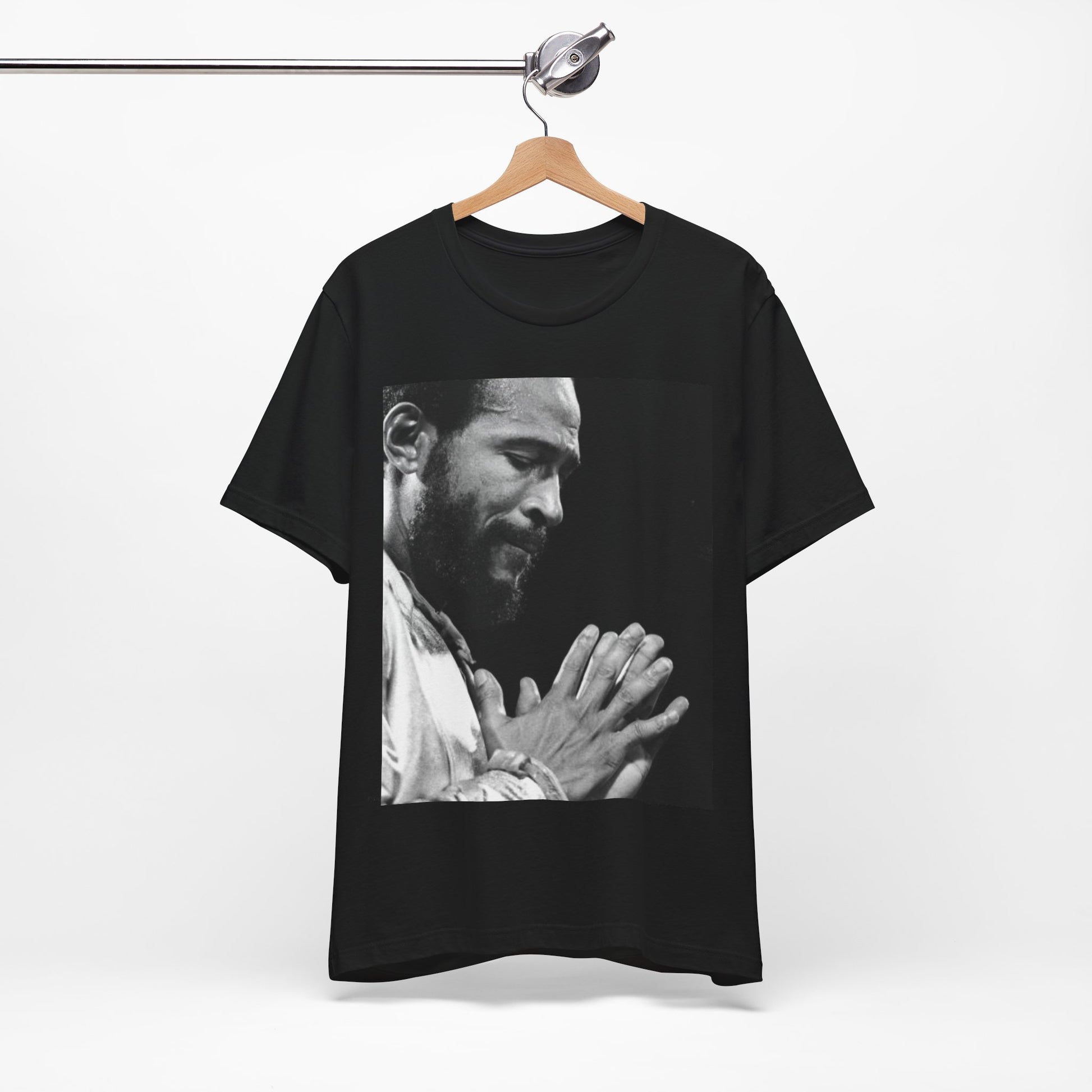 A black graphic t-shirt featuring a 70s graphic of Marvin Gaye emphasizing his soulful voice.