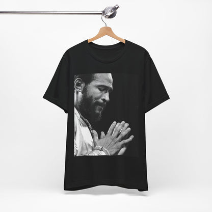 A black graphic t-shirt featuring a 70s graphic of Marvin Gaye emphasizing his soulful voice.