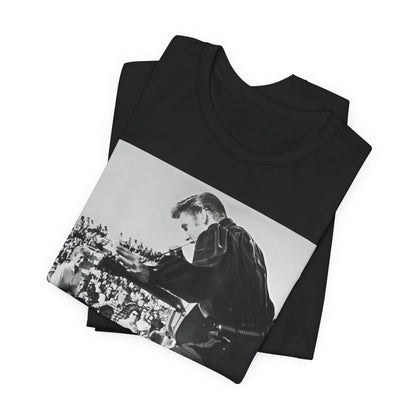 A black graphic t-shirt featuring a retro photo of Elvis Presley performing live in concert in the 1950s.