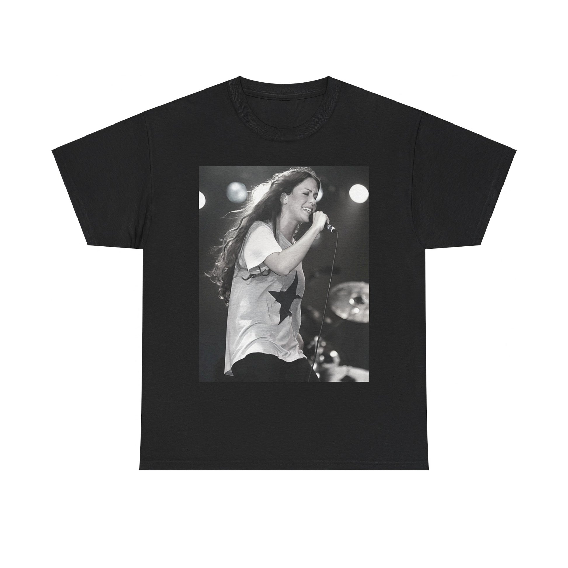 A black graphic t-shirt featuring a photo of Alanis Morissette performing live on stage in the 1990s, with a dynamic expression.