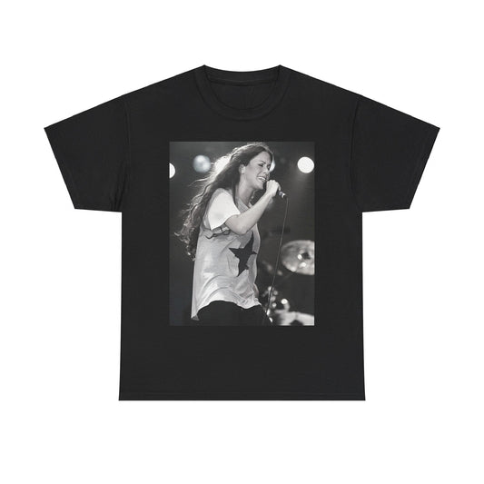 A black graphic t-shirt featuring a photo of Alanis Morissette performing live on stage in the 1990s, with a dynamic expression.