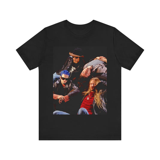 A black graphic t-shirt featuring a 90s grunge rock band graphic for Alice In Chains, possibly with band members or stylized elements.