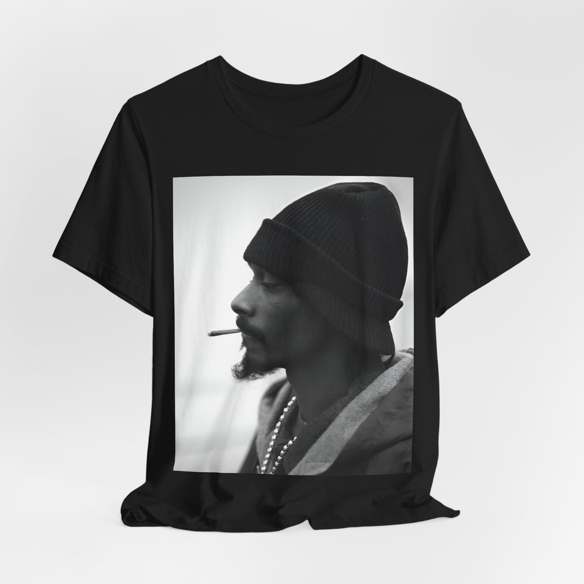 A black graphic t-shirt featuring a graphic of Snoop Dogg designed for everyday West Coast style.
