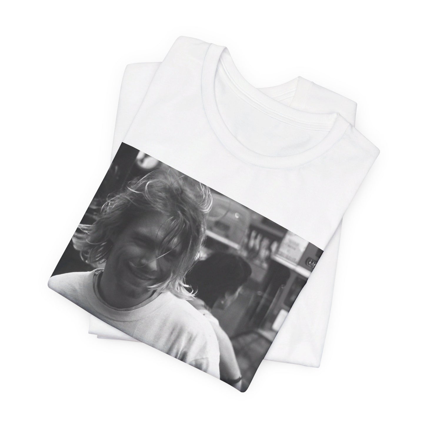 A black graphic t-shirt featuring a vintage rock legends graphic of Nirvana.