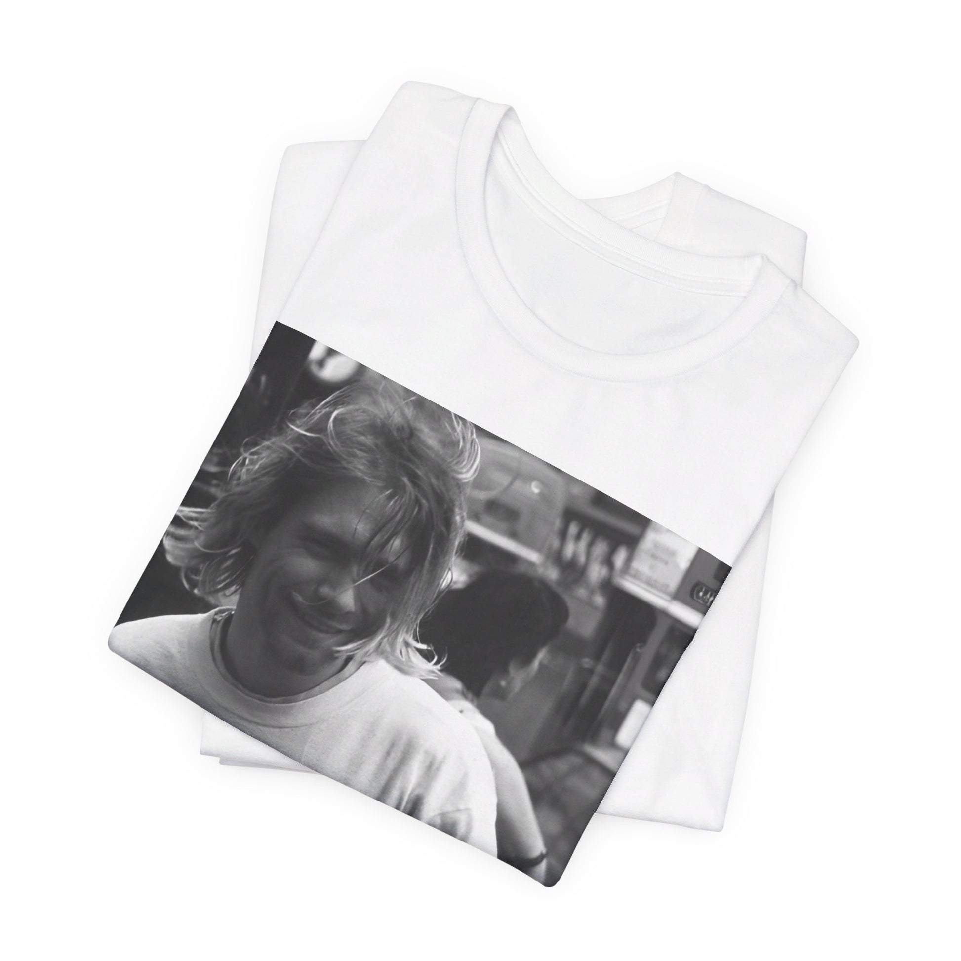 A black graphic t-shirt featuring a vintage rock legends graphic of Nirvana.