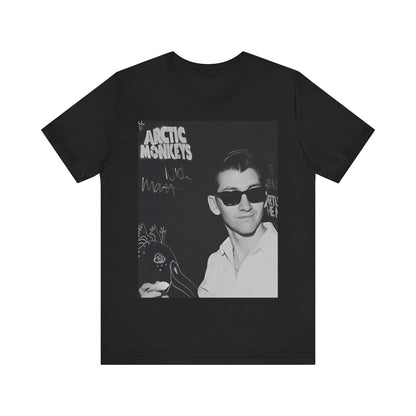 A black graphic t-shirt featuring a black and white portrait photo of Alex Turner from Arctic Monkeys, showing his signature look.