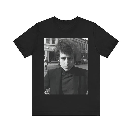 A black graphic t-shirt featuring a 60s black and white photo portrait of Bob Dylan.