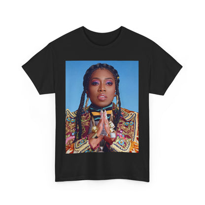 A black graphic t-shirt featuring a graphic of Missy Elliott with a cool, futuristic rap fashion aesthetic.