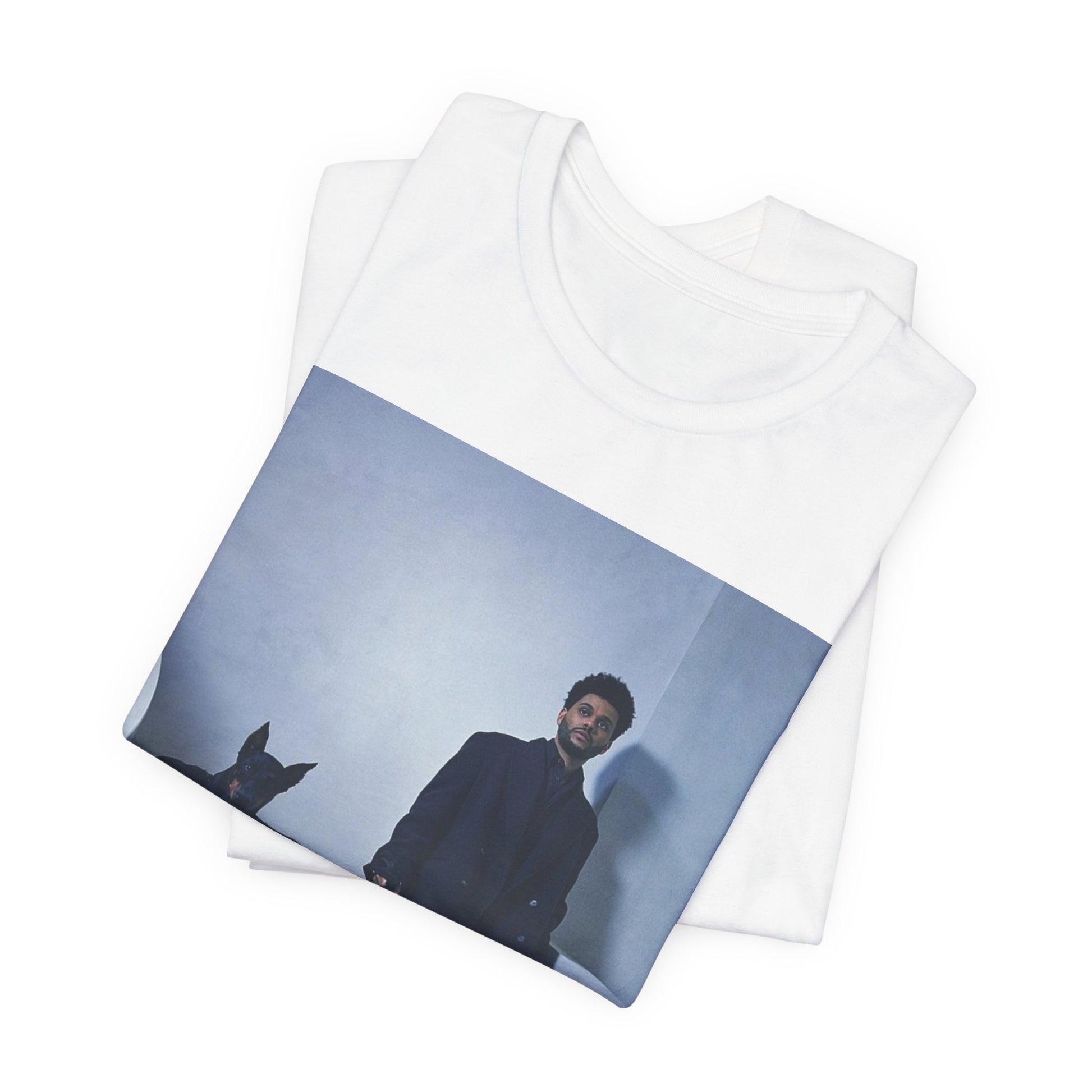 A black graphic t-shirt featuring a photo of The Weeknd with a doberman.