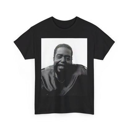 A black graphic t-shirt featuring a black and white photo of Barry White with his iconic smile.