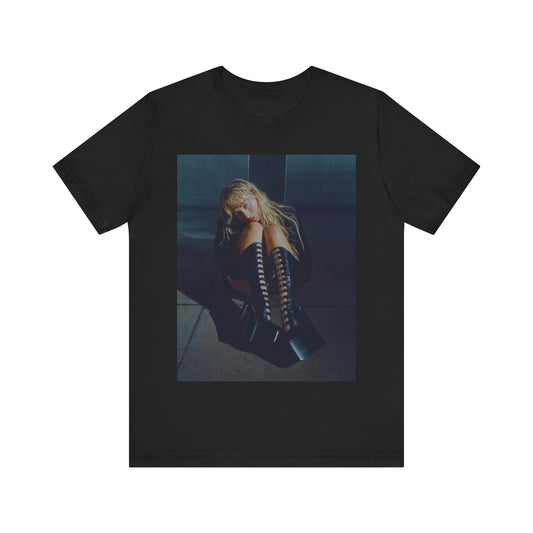 A black graphic t-shirt featuring a bold graphic of Sabrina Carpenter as a pop superstar.