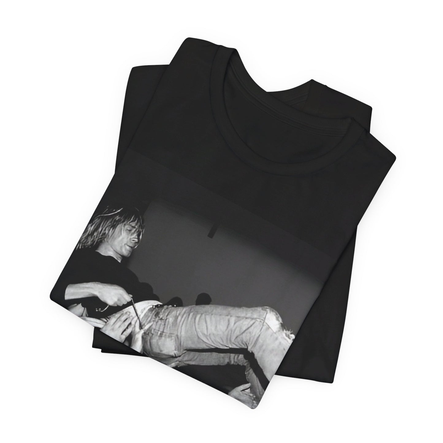 A black graphic t-shirt featuring a 90s graphic or photo of Kurt Cobain from Nirvana stage diving.