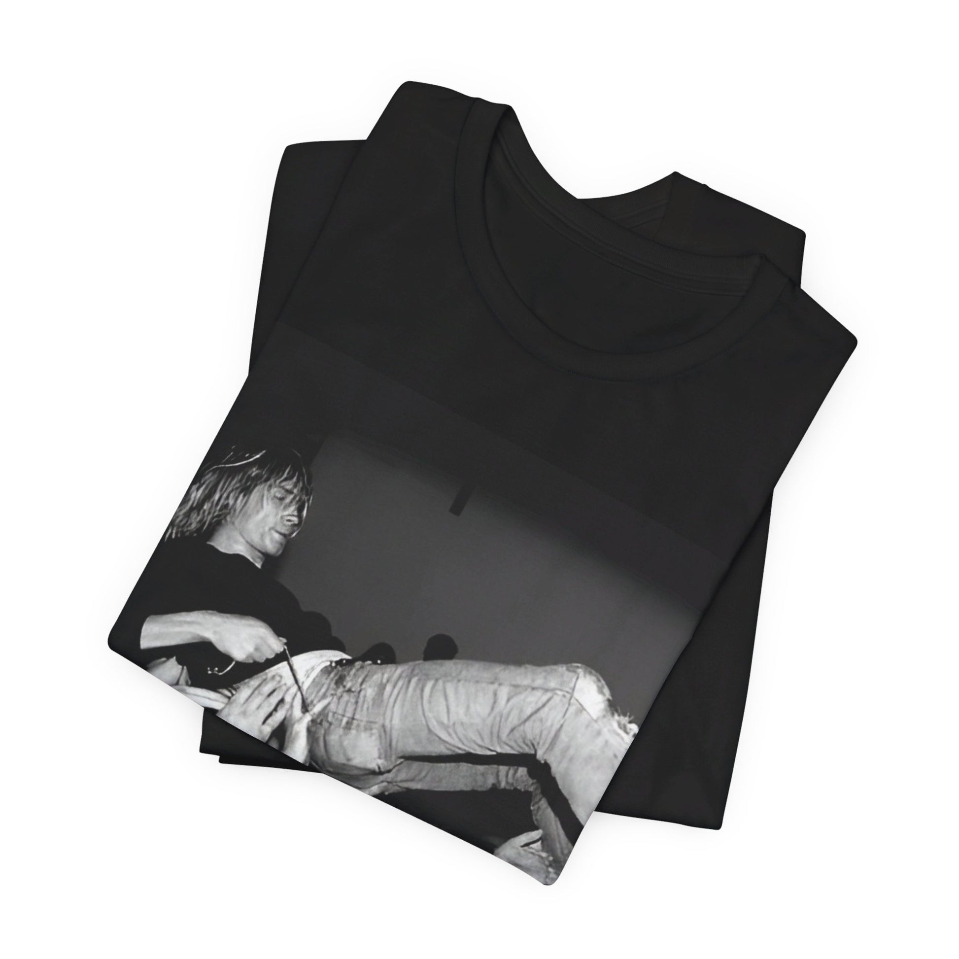 A black graphic t-shirt featuring a 90s graphic or photo of Kurt Cobain from Nirvana stage diving.
