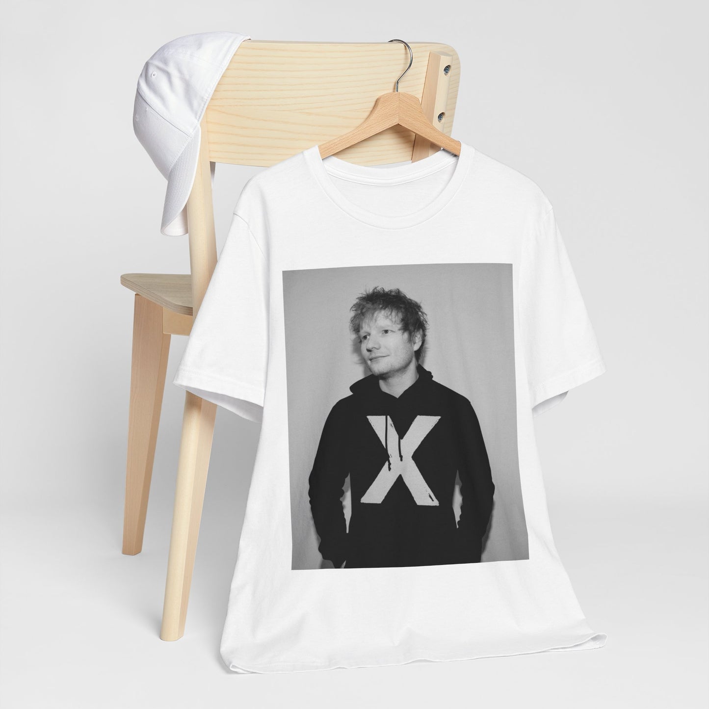 A black graphic t-shirt featuring a black and white graphic related to Ed Sheeran's album 'X'.